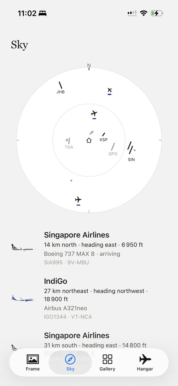The app's Sky screen: your home at the centre of a
                    compass, the aircraft crossing overhead, and each one
                    listed with its airline, heading and altitude.