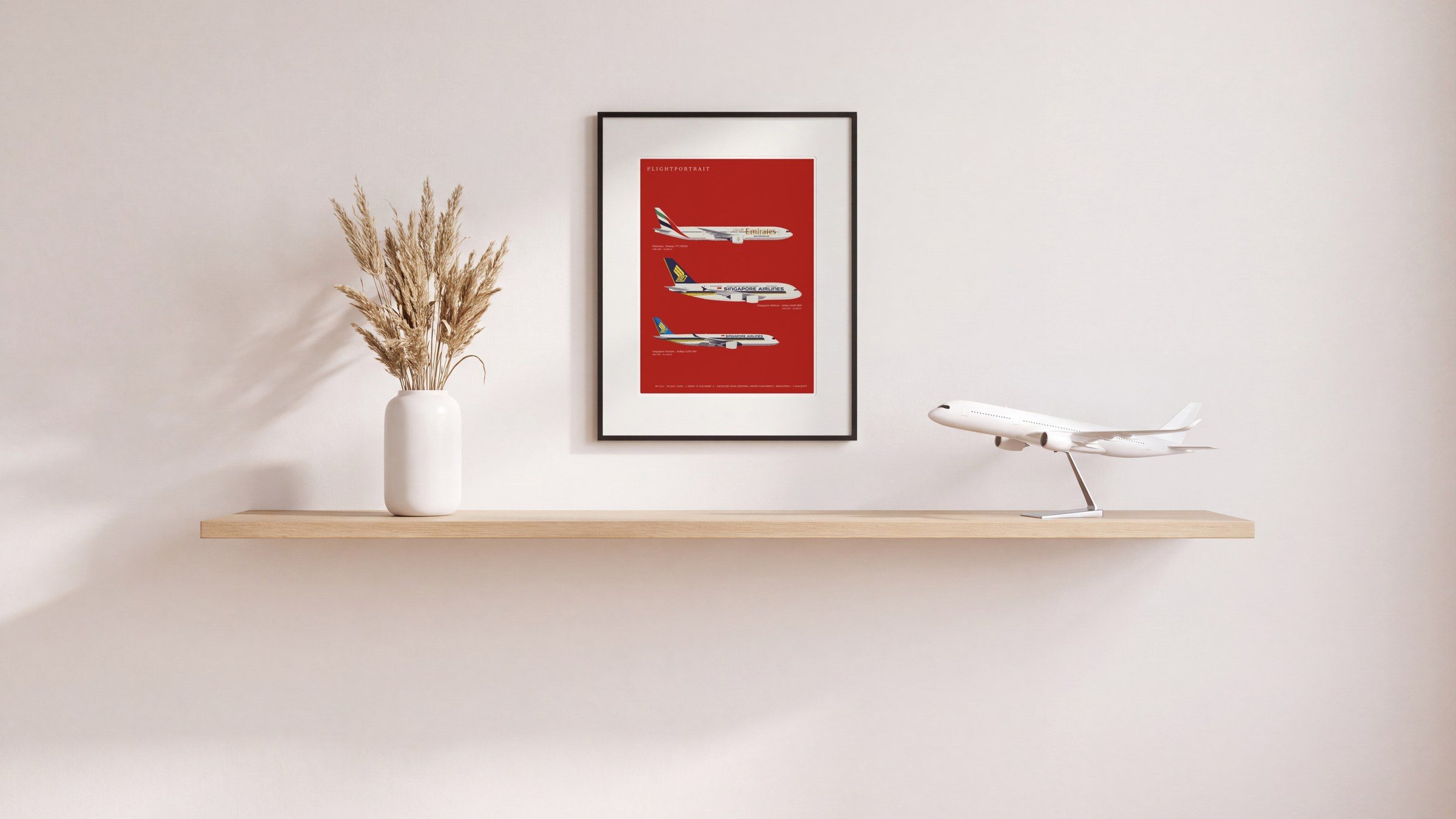 A FlightPortrait drawn on red, hanging above a shelf with books
                  and a vase of dried flowers.